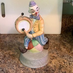Clown figurine playing drum